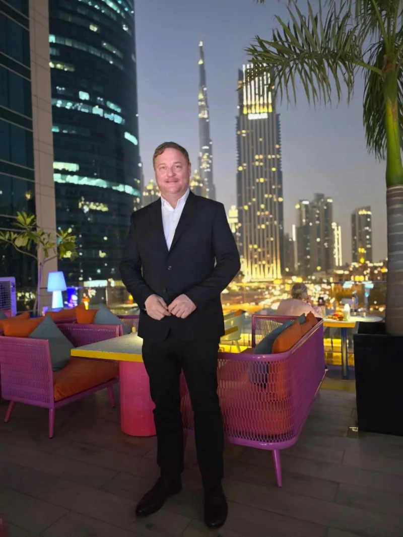 Michael Butler in Dubai, with the Burj Khalifa behind him